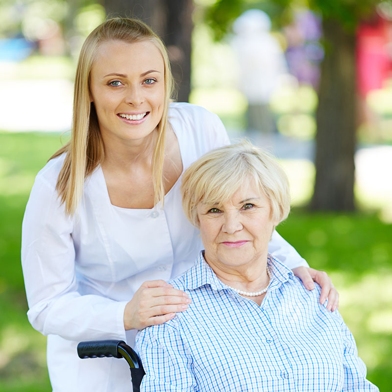 Carer team smiling together in a homecare setting